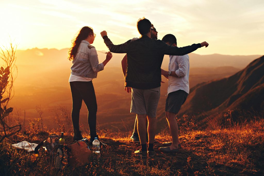 pexels photo 697244 697244 Joyful group of young adults enjoying a sunset view in a mountainous landscape in Brazil.